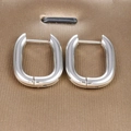 Detailed close-up of polished silver stainless steel U-shaped hoop earrings on silk - U-shaped Ear Buckle / Silver Style (45068-7)