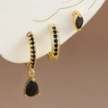 Juego de pendientes dorados con circonitas negras en una colección de tres piezas de joyería - Dorado-Negro