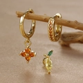 Detail of clover zircon drop earrings and lemon stud set on wooden branch display - Lemon Style (Y26118-6) / Gold
