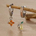 Macro view of clover zircon earrings and lemon studs on a textured satin background - Lemon Style (Y26118-6) / Silver
