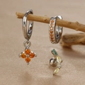Macro shot of silver clover earrings set with orange zircon and colorful crystal studs - Geometric Arc (Y26118-10) / Silver