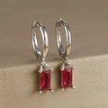 Detailed view of silver finish huggie earrings with a faceted red rectangle gemstone - Rectangular Gemstone Hoop (Y20278) / Silver - Red