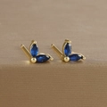 Macro shot of gold-plated leaf earrings with marquise blue zircon in a claw setting - Marquise Double Zirconia Leaf Stud (Y20283) / Gold-Dark Blue