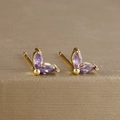 Detailed macro view of purple zircon flower earrings set in gold plated brass material - Marquise Double Zirconia Leaf Stud (Y20283) / Gold-Purple