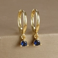 Macro shot of gold-plated hoop earrings featuring a vibrant blue zircon gemstone pendant - Round Gemstone Pendant Hoop (Y20301) / Gold-Dark Blue