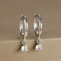 Close-up of silver-tone hoop earrings featuring a single round zircon on a metal stand - Round Gemstone Pendant Hoop (Y20301) / Silver-White