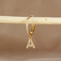 Detailed close-up of a gold-plated letter A earring with micro-pave cubic zirconia accents - 1 Piece / Gold - Letter A
