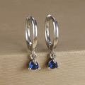 Detailed close-up of silver hoop earrings featuring blue zircon drops in a three-claw setting - Round Gemstone Pendant Hoop (Y20301) / Silver-Dark Blue