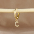 Close-up of gold-plated letter C earring featuring micro-pave cubic zirconia on wood bar - 1 Piece / Gold - Letter C