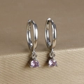 Macro detail of silver-plated hoop earrings featuring claw-set purple zircon drops - Round Gemstone Pendant Hoop (Y20301) / Silver - Purple