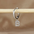 Detailed macro view of silver letter B huggie hoop earring with micro-pave cubic zirconia - 1 Piece / Silver-Letter B