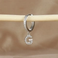 Macro shot of silver letter G hoop earring with micro-paved cubic zirconia stones - 1 Piece / Silver-Letter G