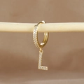 Detailed view of gold hoop earring with micro-paved zircon letter L on a branch - 1 Piece / Gold - Letter L