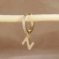 Detailed close-up of a gold-plated letter N huggie earring with micro-pave cubic zirconia - 1 Piece / Gold - Letter N