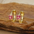 Detail of gold floral huggie earrings with fuchsia zircons on a wooden texture base - Gold Four-petal Flower Red Zircon Hoop Earrings (Y20309)