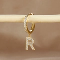 Detailed close-up of a gold-plated letter R earring with micro-pave cubic zirconia - 1 Piece / Gold - Letter R