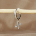 Detail of silver letter X charm earring with micro-pave cubic zirconia on a wooden branch - 1 Piece / Silver-Letter X