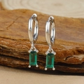 Close-up of silver hoop earrings with rectangular emerald zircon charms on wood - Silver Rectangle Green Zircon Pendant Hoop Earrings (Y20278)
