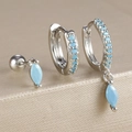 Détails d'un ensemble de boucles d'oreilles en argent avec zircons et pierres turquoise - Métal Argenté Avec Zirconia Bleu (Y26259)
