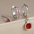 Macro detail of three-piece silver earring set with pink zircon and red gemstones - Y26247 Style (Y26247) / Silver-Red