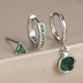 Close-up of three-piece silver earrings set with micro-pave green zircon and gemstones - Silver-Green