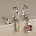Macro detail of geometric silver zircon earrings set with champagne and pink crystals - Silver-Champagne