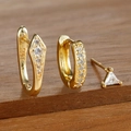 Detailed macro view of S925 sterling silver stamp on gold earrings set with zircons - Three-Piece Set / Gold-White