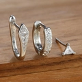 Close-up of S925 sterling silver hoop earrings and triangle zircon stud on wood - Three-Piece Set / Silver-White
