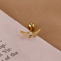 Macro shot of gold-plated crescent moon cartilage earring with cubic zirconia and ball screw back - Gold Curved Gem Style (Y26278-1)