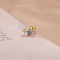 Detailed view of gold-plated stud earring with three multicolor cubic zirconia stones - Gold Three-Color Inlaid Row Style (76006)