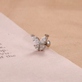 Macro shot of silver butterfly stud earring with clear marquise-cut cubic zirconia crystals - Silver White Zirconia Butterfly Style (E1236)