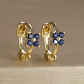 Gold-plated hoop earrings with blue zircon flower charm displayed on a metallic stand - Four-petal Flower Hoop (Y20309) / Gold-Dark Blue
