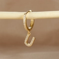 Gold plated huggie earring with micro-pave zircon letter U pendant on wood stand - 1 Piece / Gold - Letter U