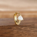 Close-up of golden hoop earring with heart-shaped zircon on a dark wood stand - Style 3 Heart (3-Gold-White-1pc)
