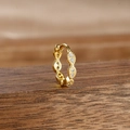 Close-up of golden huggie earring with micro-pave white stones on a wooden stand - Style 9 Wave Full Rhinestone (9-Gold-White-1pc)