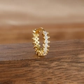 Detailed close-up of a gold-plated hoop earring with micro-pave white zircon stones - Style 11 Pave Hoop (11-Gold-White-1pc)