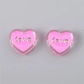 Detail view of pink transparent acrylic heart beads featuring embossed Love lettering - Heart (LOVE) / 4 Pieces/Pack (24x22x9mm) / Deep Pink