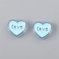 Detailed view of heart-shaped blue acrylic beads with silver Love letter inlay for DIY jewelry - Heart (LOVE) / 4 Pieces/Pack (24x22x9mm) / Light Blue