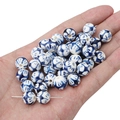 Blue and white porcelain ceramic beads for DIY jewelry making held in hand - 2 Pieces/Pack / Doodle Dark Blue