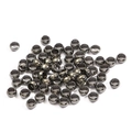 Flat lay of small black metallic spacer beads for DIY jewelry and bracelet making - 1.5mm / 500 Pieces/Pack / Gunmetal