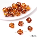 Macro detail of 11.5mm amber acrylic pumpkin bead with gold painted vintage patterns - Chinese Knot Round Shape