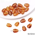 Macro shot of 9x12mm amber leaf beads with gold texture for DIY jewelry making - Succulent Leaf Shape