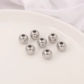 Set of seven polished silver stainless steel spherical beads with holes for DIY jewelry - 10mm Round Bead (10 Pieces/Pack)