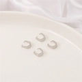 Set of four silver U-shaped stainless steel jewelry connectors on white silk background - 4x9mm Bail Clasp (50 Pieces/Pack)