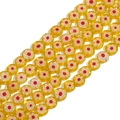 Macro detail of yellow millefiori glass beads with red and white floral patterns for DIY - 6mm (Approx. 65 Pieces) / Yellow