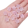 Macro view of a pale pink star-shaped resin bead with embossed floral texture for DIY jewelry - 10 Pieces/Pack (15x14mm) / Light Pink