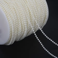 Detail view of double-strand ABS pearl chain roll for wedding dress and DIY accessories - Beige Small Connected Bead Chain (3mm, Approx. 110m/Roll)