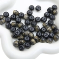 Macro shot of black resin beads with gold streaks for DIY jewelry making and craft projects - 11x8mm / 10Pcs/Pack / Black
