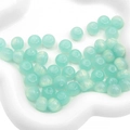 Macro shot of mint green translucent resin beads for DIY jewelry in ceramic dish - 11x8mm / 10Pcs/Pack / Green