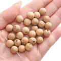 Natural 10mm round wooden beads for DIY bracelets showing smooth texture and wood grain - 10mm (30 Pieces/Pack) / Peach Wood